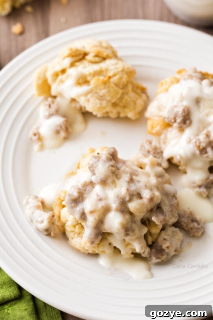 Buttermilk biscuits smothered in sausage gravy, portioned for two.