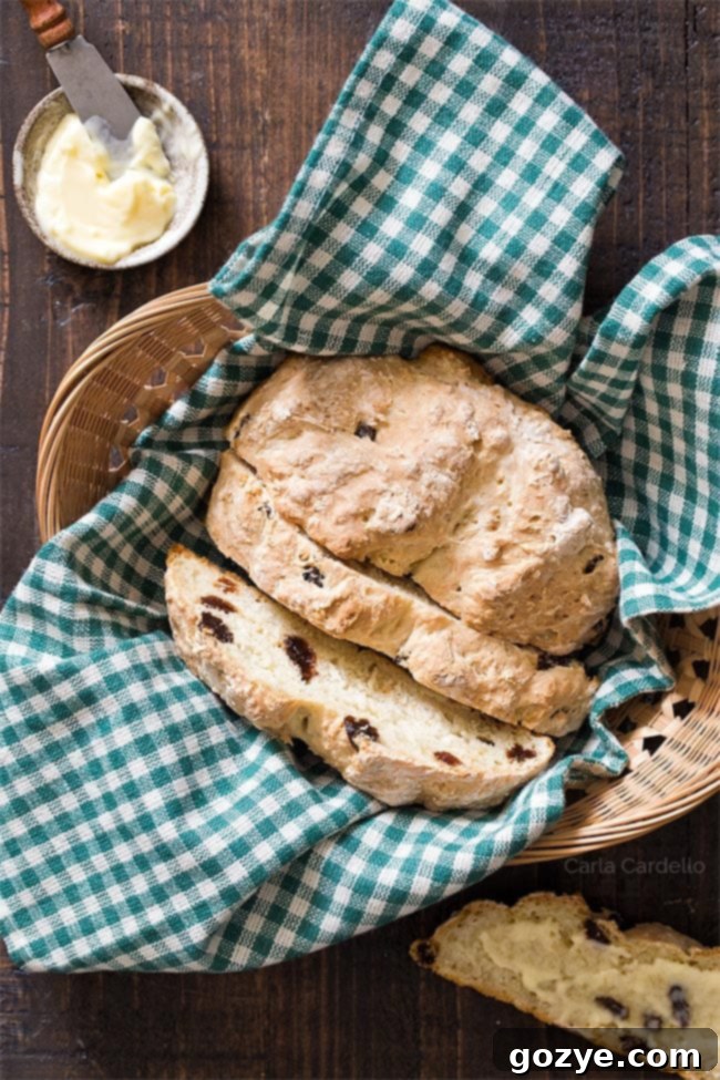 A small loaf of mini Irish soda bread with raisins.