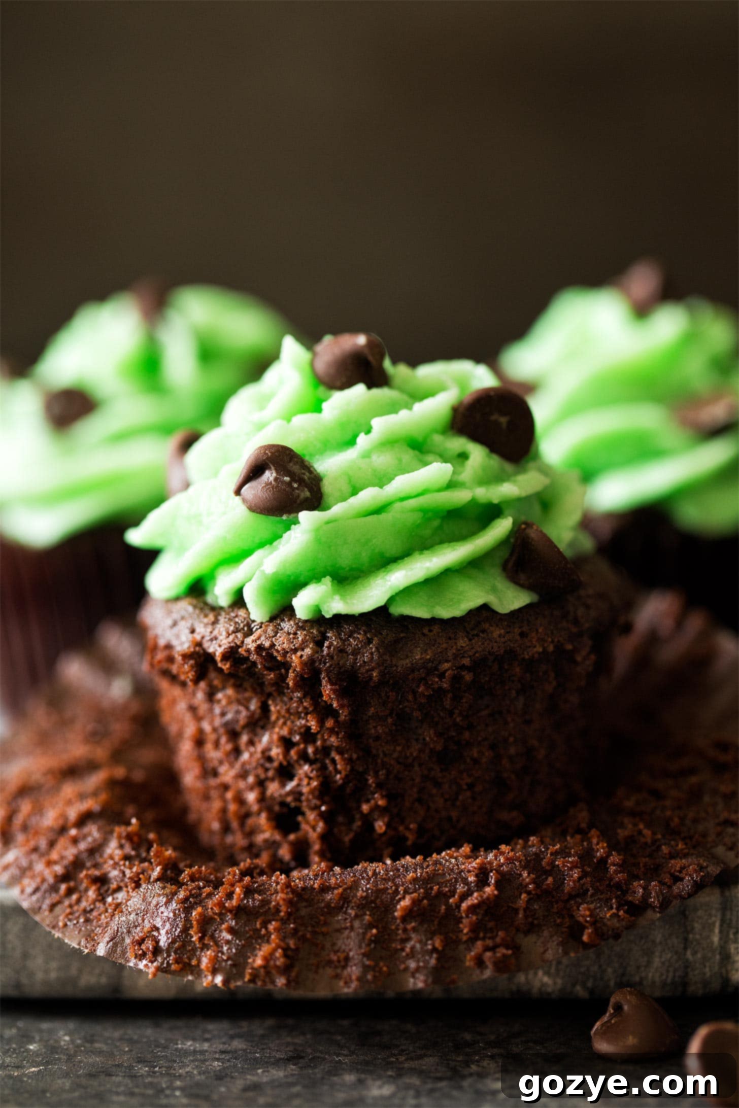 Mint frosting piped beautifully on top of mint chocolate cupcakes.