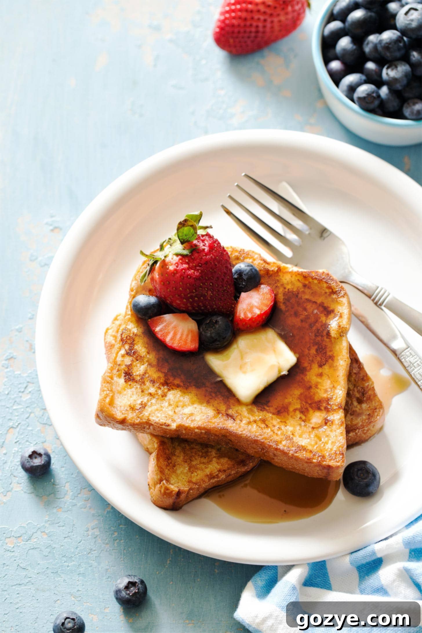 Two slices of small batch French toast on white plate