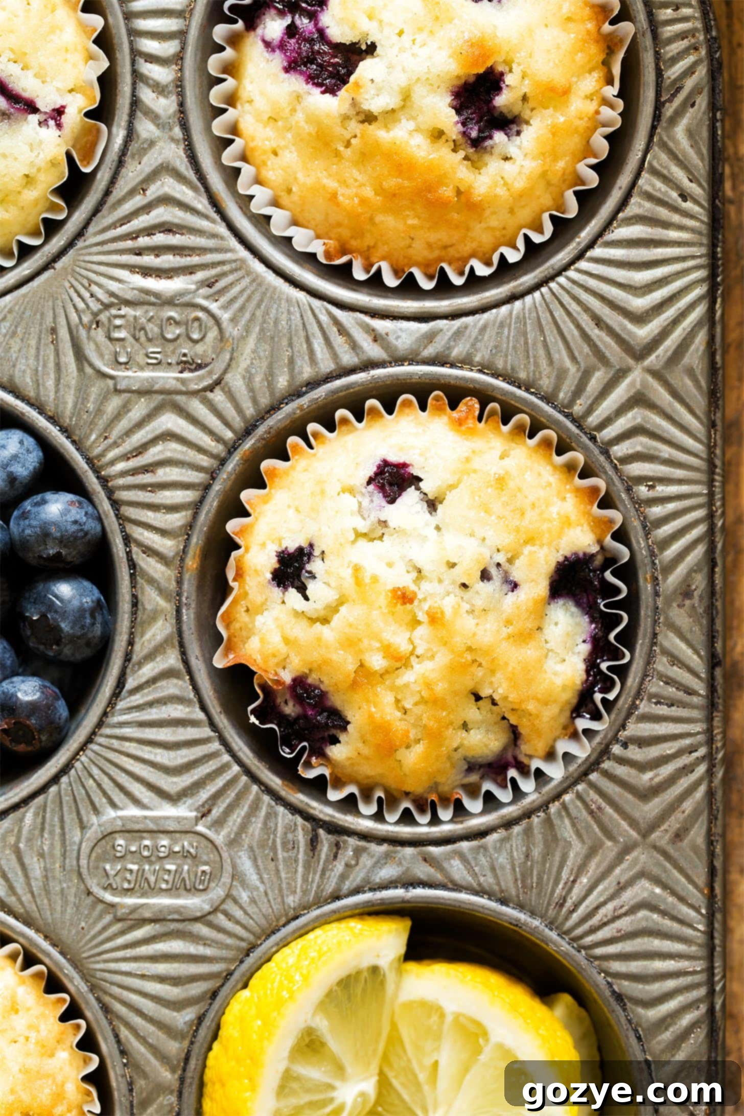 Cozy Small Batch Blueberry Muffins 5 Close up of blueberry muffin in pan