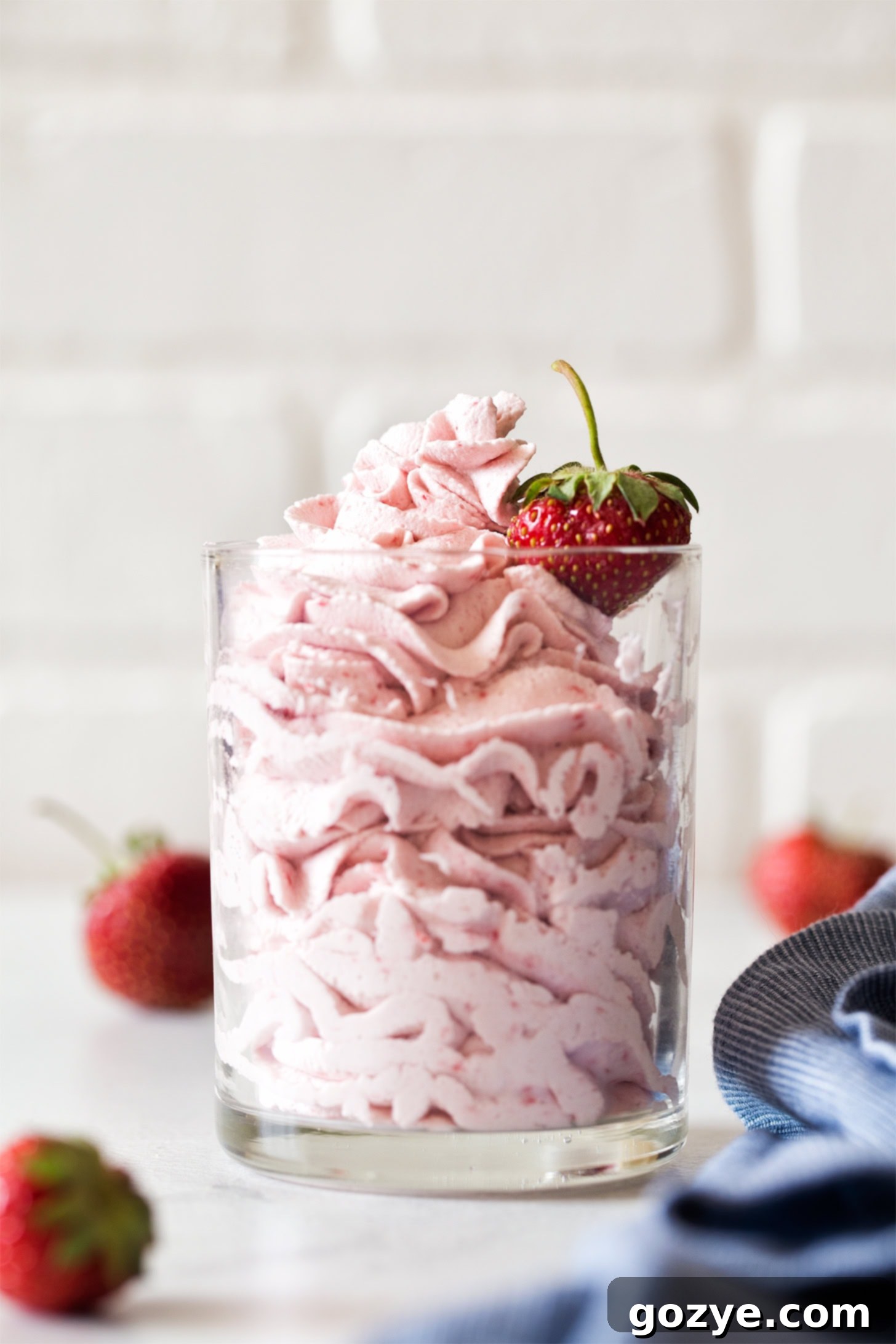 Strawberry whipped cream piped in a glass
