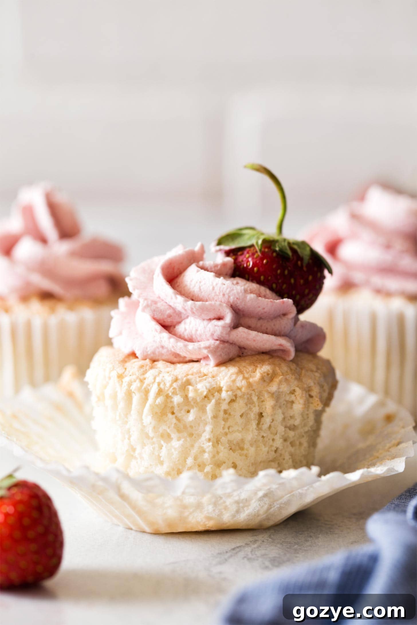 Angel Food Cupcakes with whipped strawberry frosting