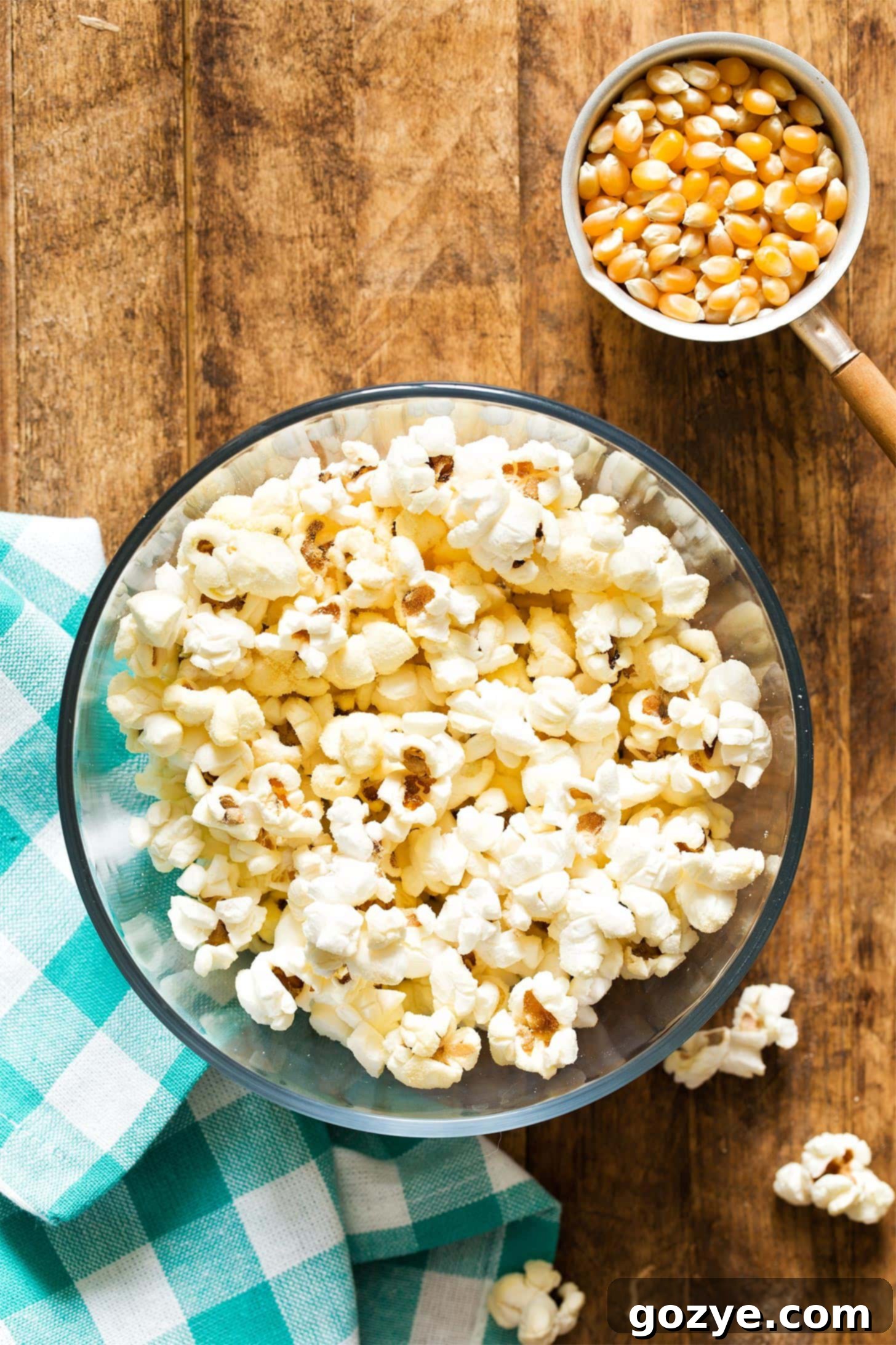 A generously filled bowl of freshly popped stovetop popcorn, ready for snacking.