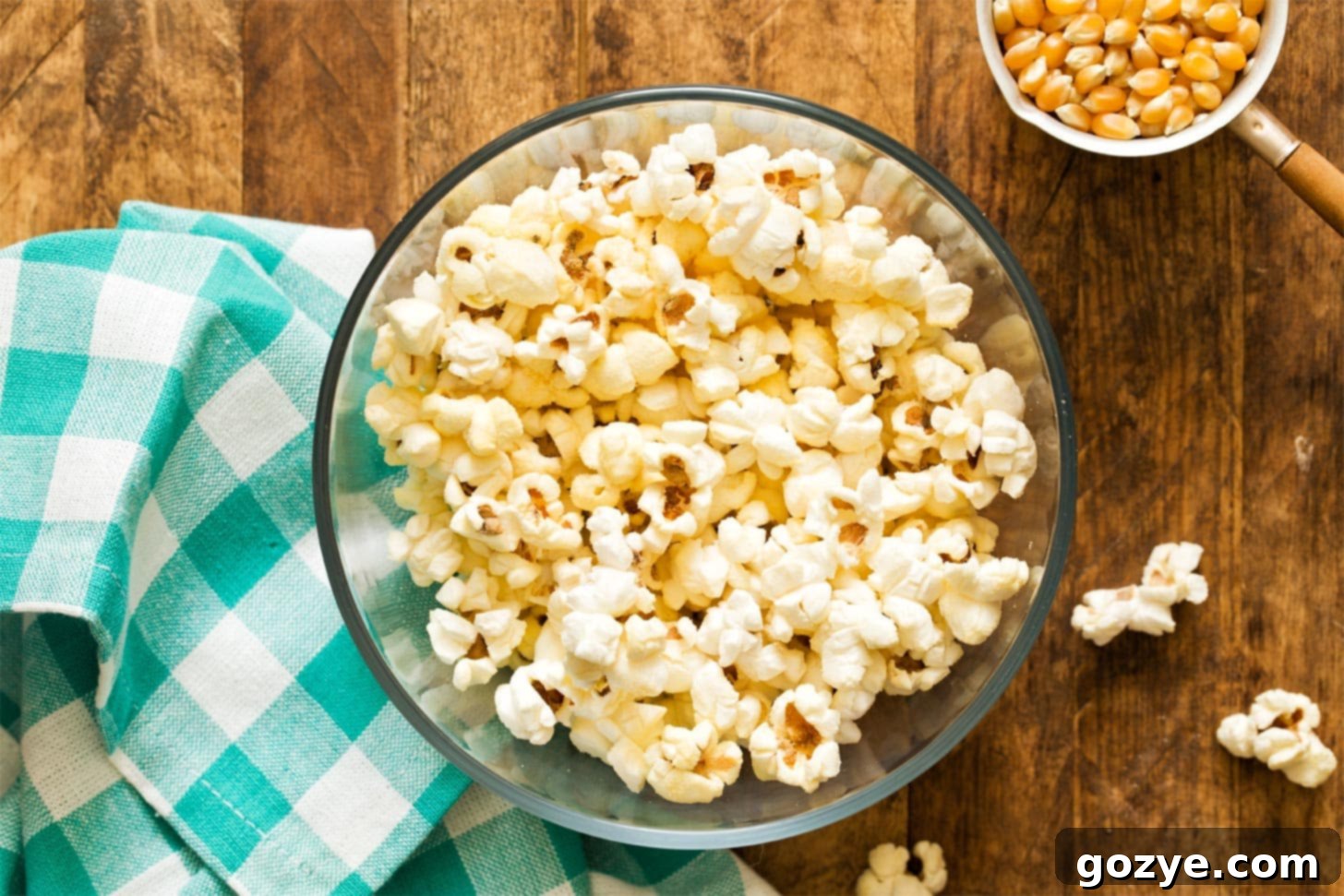 A close-up shot of a bowl filled with golden stovetop popcorn, showing its irresistible texture.