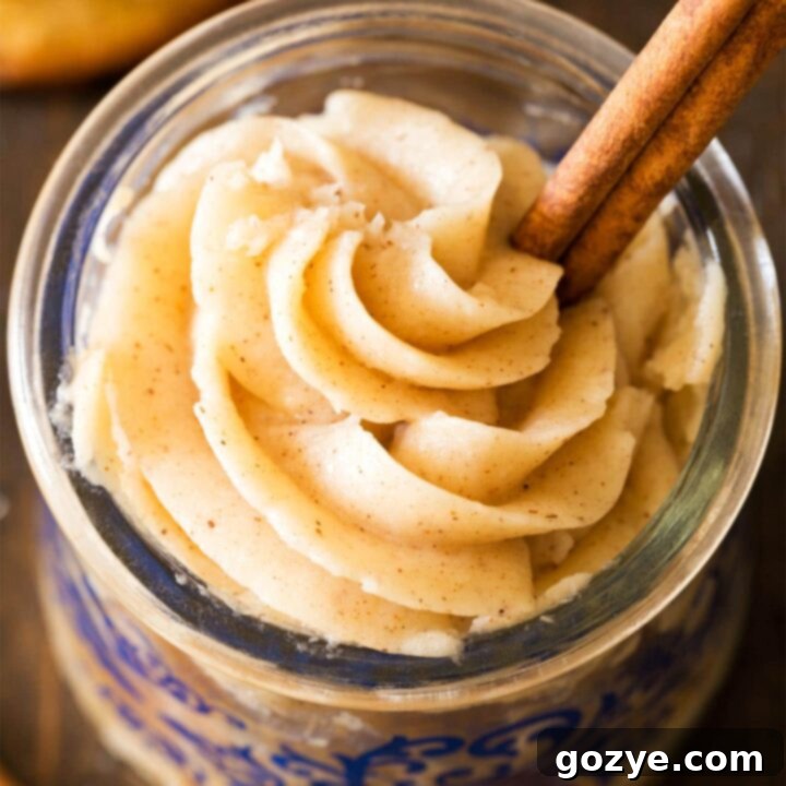 Cinnamon frosting in jar with cinnamon stick