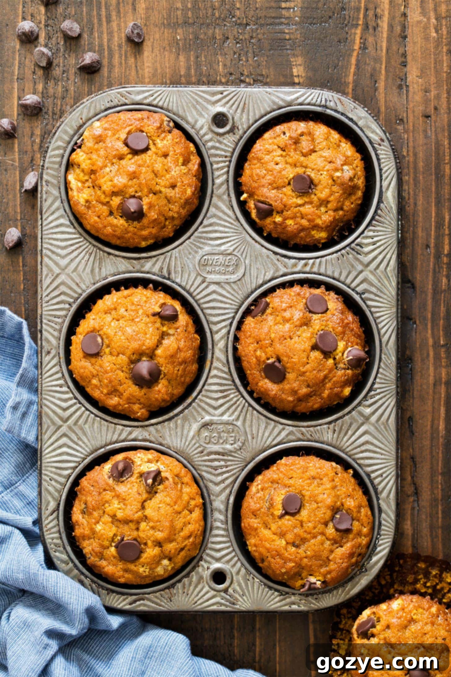 Pumpkin spice muffins baking in a muffin pan