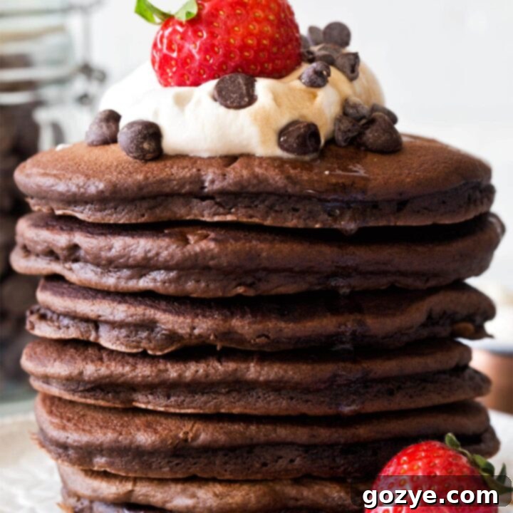 Close up photo of a stack of homemade chocolate pancakes for the recipe card
