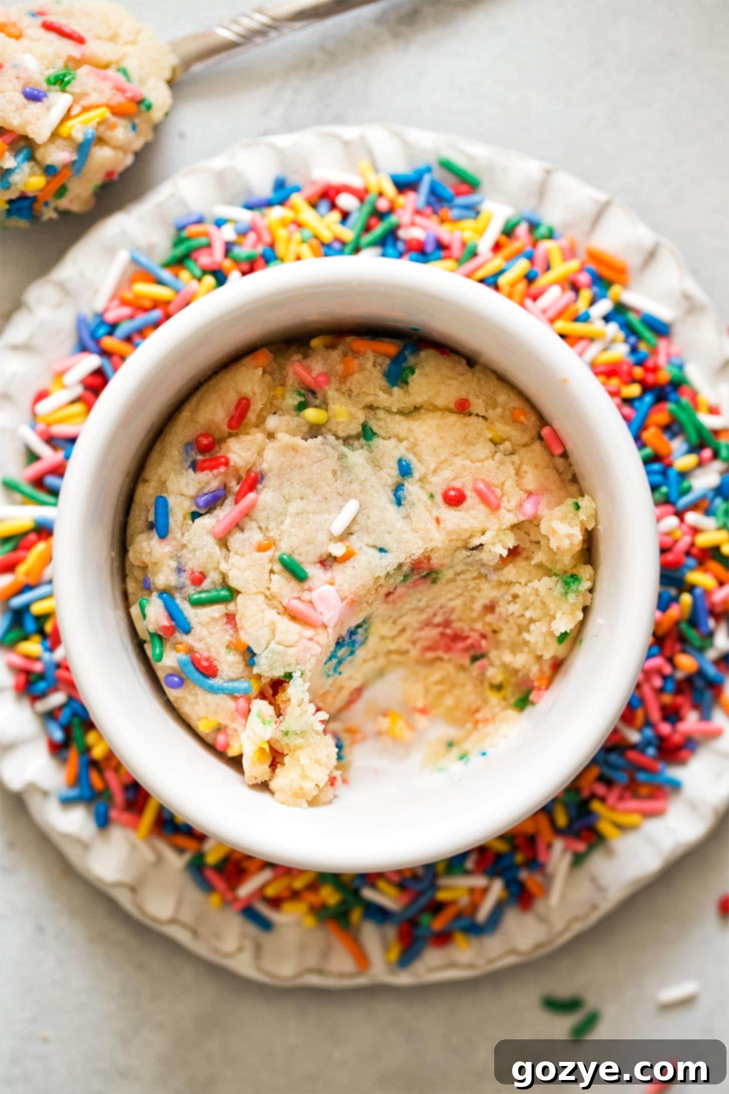 Microwave Sugar Cookie with a spoonful taken out