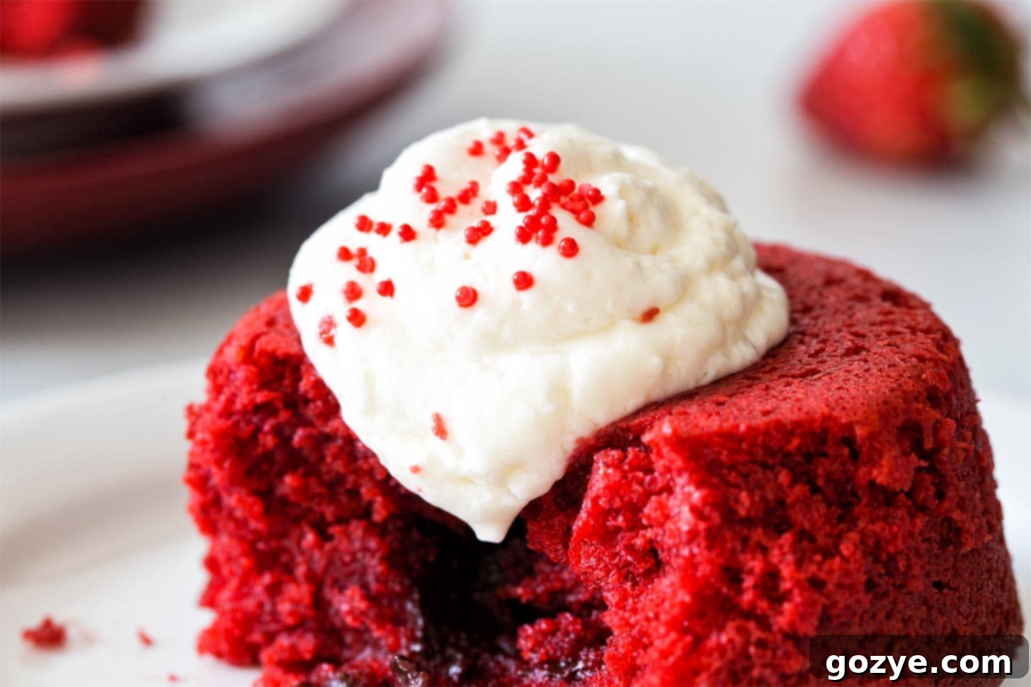 Whipped Cream With Cream Cheese on top of red velvet cake