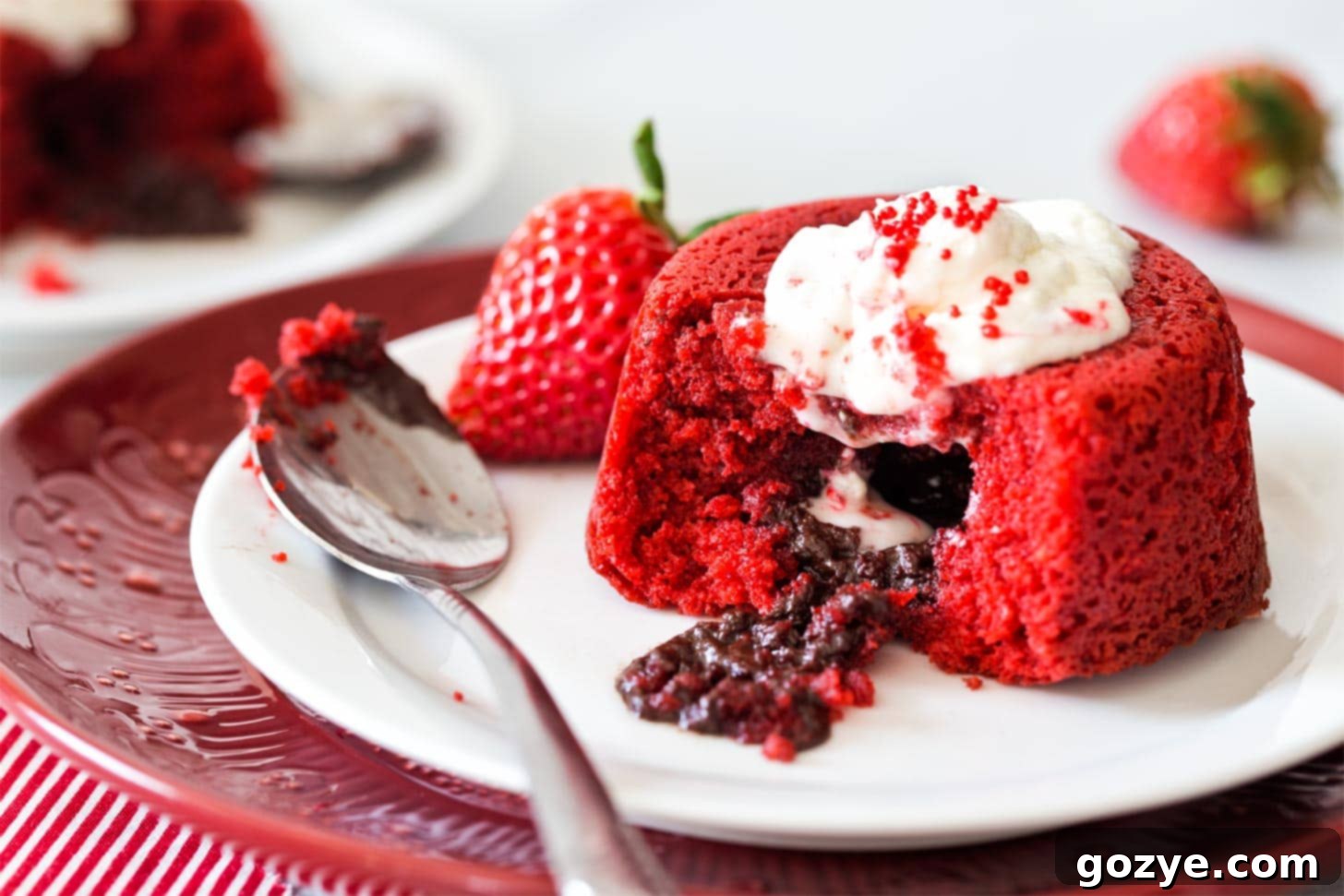 Red Velvet Molten Cake with spoon on white plate