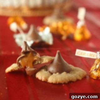 Caramel Kiss Cinnamon Spritz Cookies with melted caramel tops on a wire cooling rack.