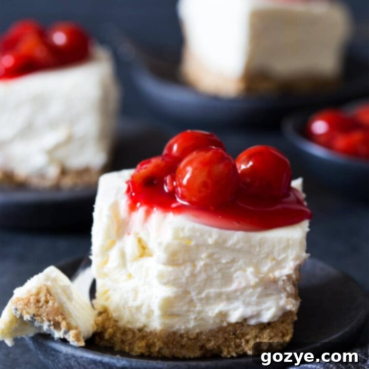 No Bake Cheesecake Bars with a bite taken with a fork