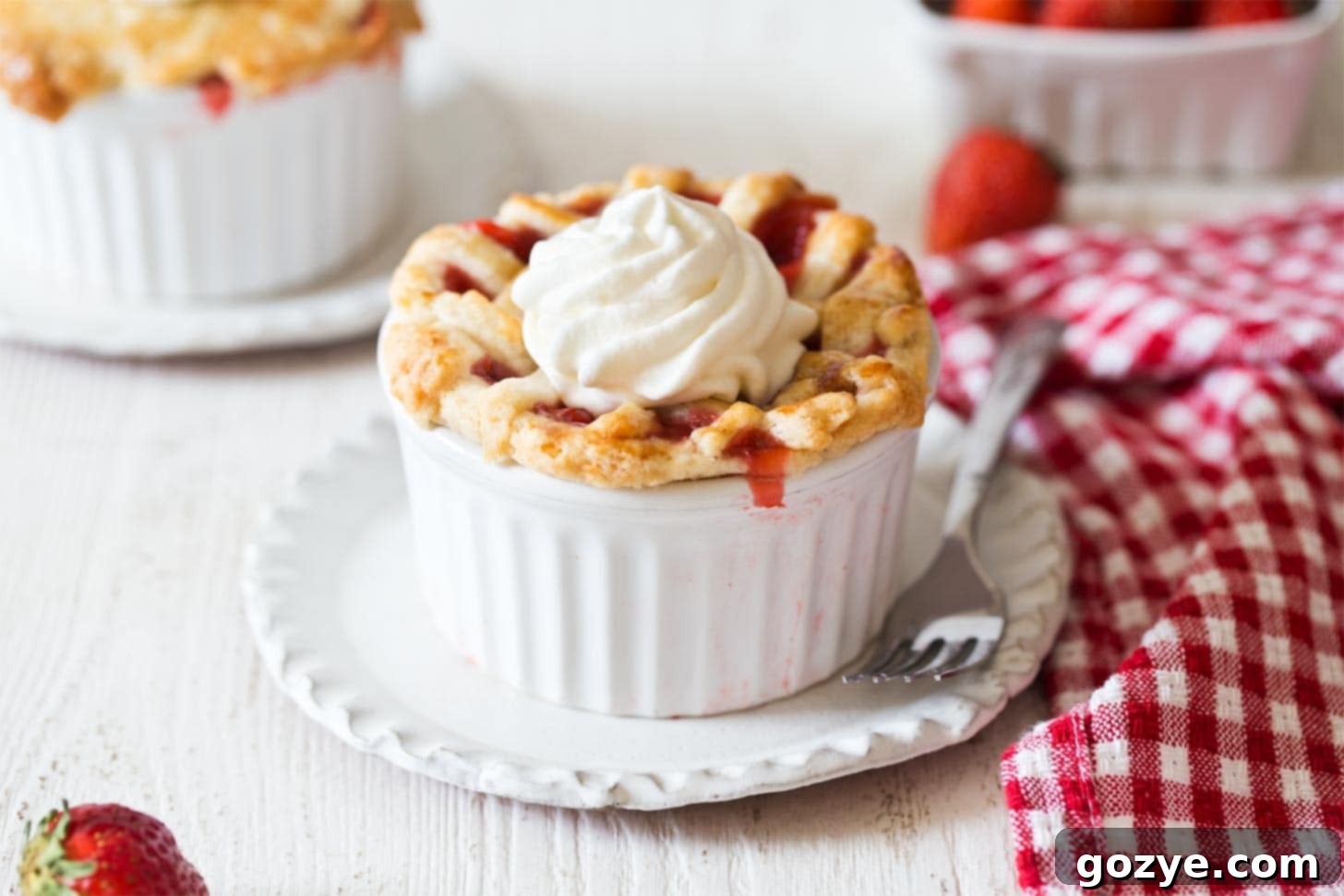 Bubbling mini strawberry pies with pie crust