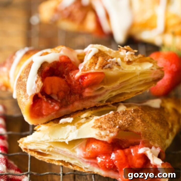 Strawberry Turnovers cut in half with strawberry pie filling
