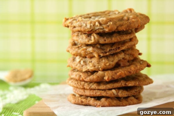 Freshly baked Brown Sugar Cinnamon Coconut Cookies arranged on a baking sheet, showing their thin, crinkled texture.