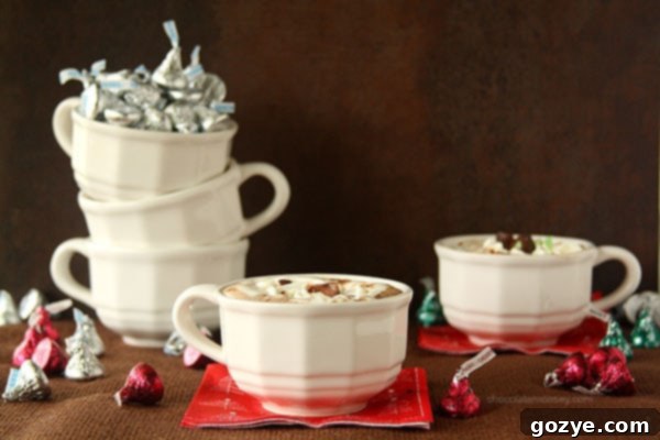 Rich Cherry Cordial and Mint Truffle Kiss Hot Chocolate with fluffy Marshmallow Whipped Cream, perfect for winter indulgence.
