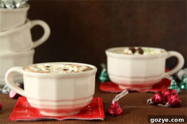 A festive close-up of Cherry Cordial Hot Chocolate with whipped cream and chocolate shavings, ready to be enjoyed.