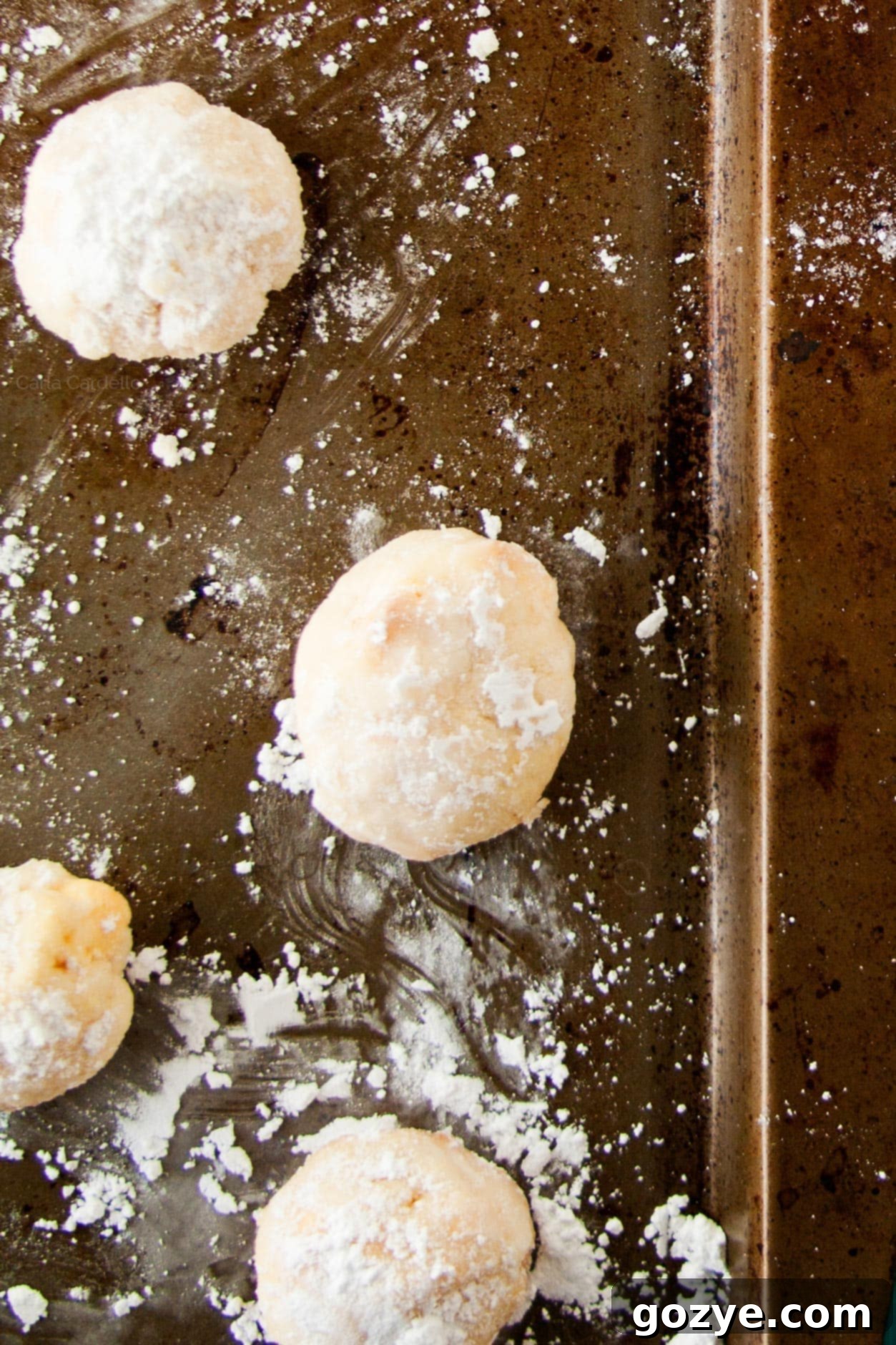 Lemon Wedding Cookies on a baking tray