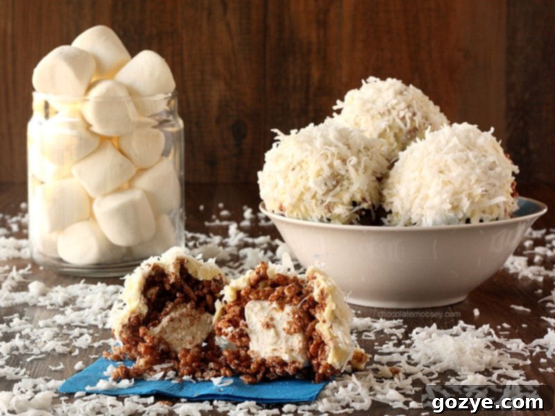 Giant Rice Crispy Treat Snowballs 4 Rows of partially dipped Rice Crispy Treat Snowballs, glistening with white chocolate and coconut