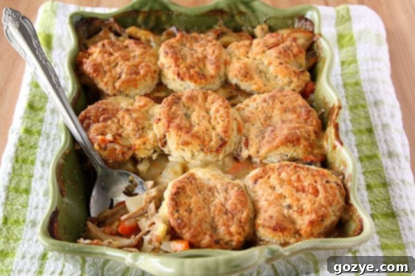 Chicken Pot Pie Casserole topped with homemade bacon cheddar biscuits