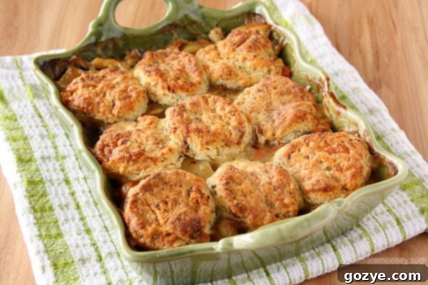 Chicken Pot Pie Casserole topped with homemade bacon cheddar biscuits