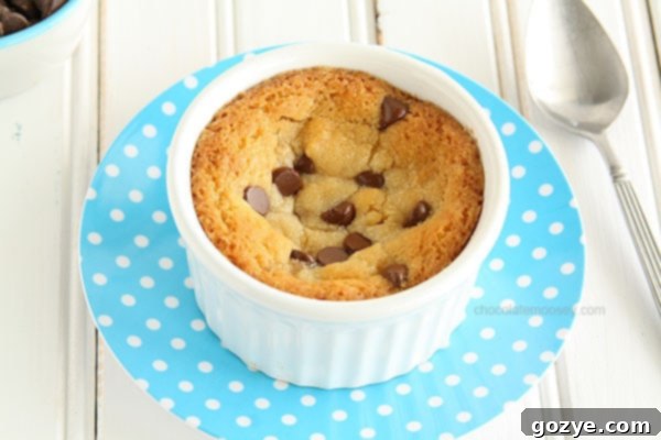 Close-up of a freshly baked Single Chocolate Chip Cookie For One in a white ramekin