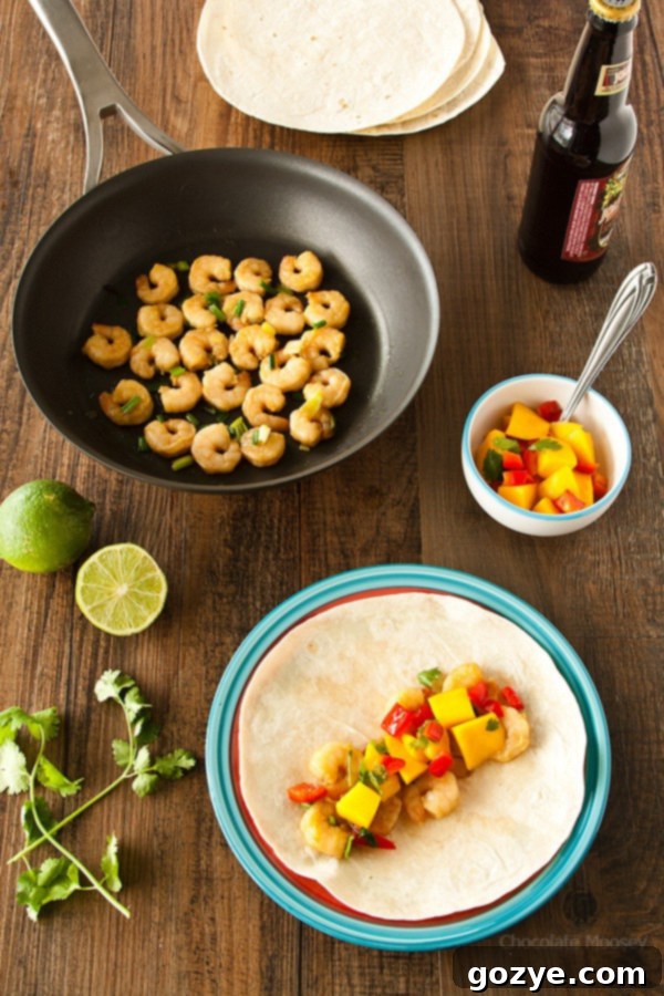 Flavorful Asian Shrimp Tacos with zesty Mango Salsa, a quick and healthy dinner option ready in under 60 minutes.