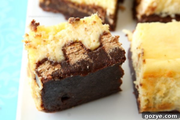Kit Kat Cheesecake Brownies from www.chocolatemoosey.com