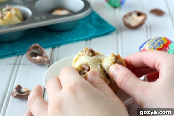 Drizzling sweet glaze over warm Cadbury Creme Egg Pull Apart Sweet Rolls