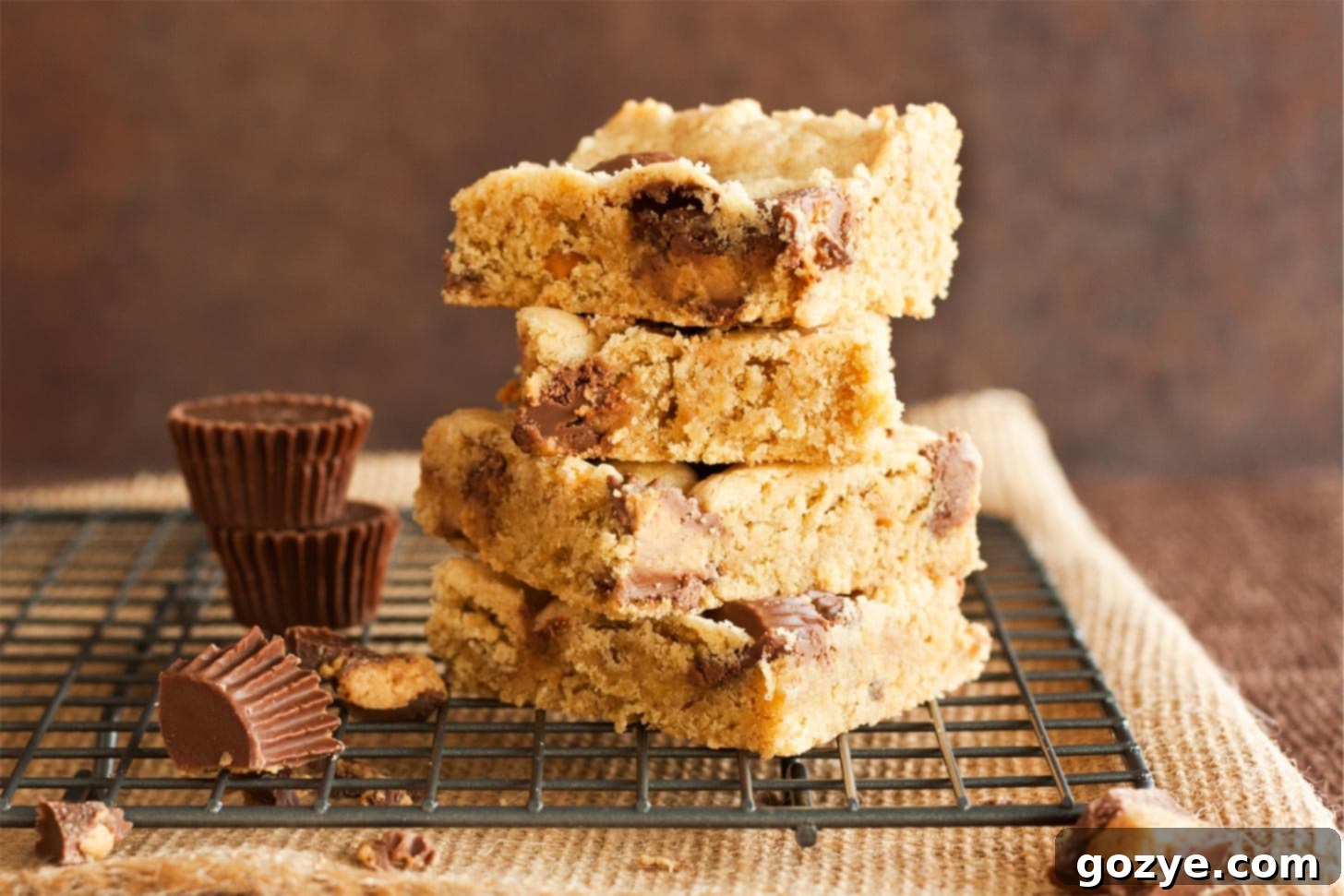Peanut Butter Chocolate Chip Cookie Bars stacked on wire rack