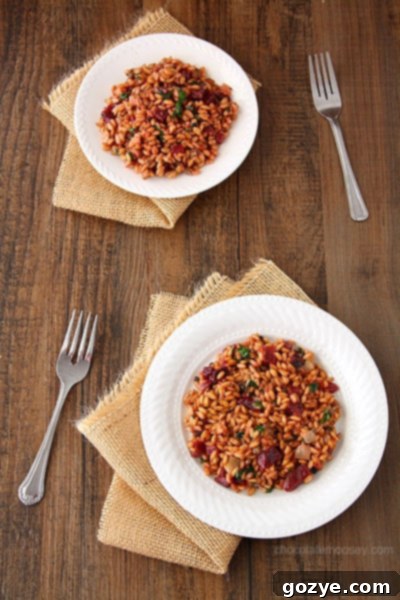 Close-up of Beet, Spinach, and Goat Cheese Farro Risotto, showing the creamy farro grains, vibrant beet pieces, and wilted spinach.