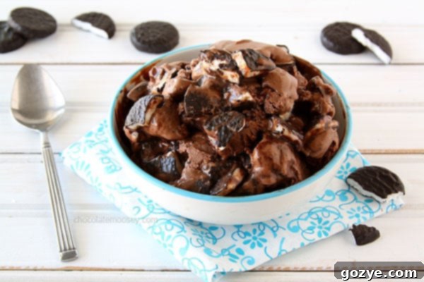 A bowl of freshly scooped Peppermint Patty Ice Cream, with a spoon ready for enjoyment.