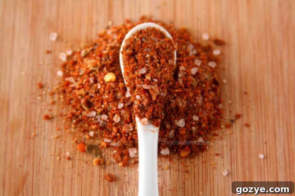 A dish of Mexican rice or a similar side dish, perhaps with corn and peppers.