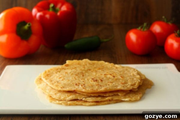 Delicious Homemade Spiced Flour Tortillas stacked on a plate