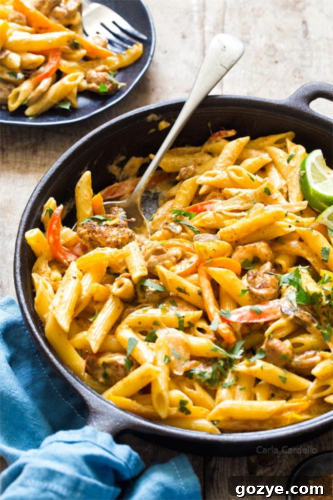 Chicken Fajita Pasta simmering in a large skillet, with visible vegetables and sauce