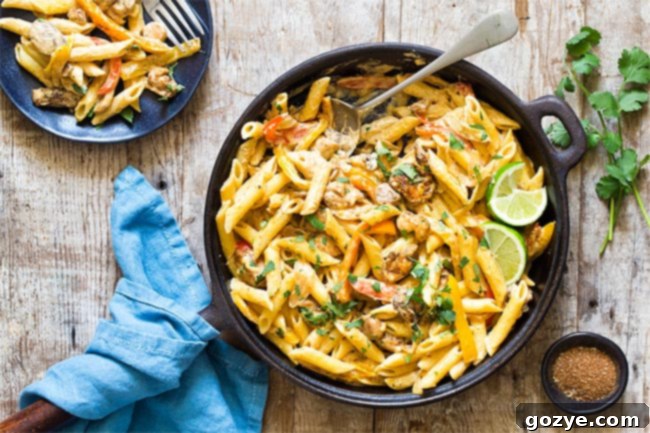 Chicken fajita pasta beautifully presented in a skillet, ready for serving