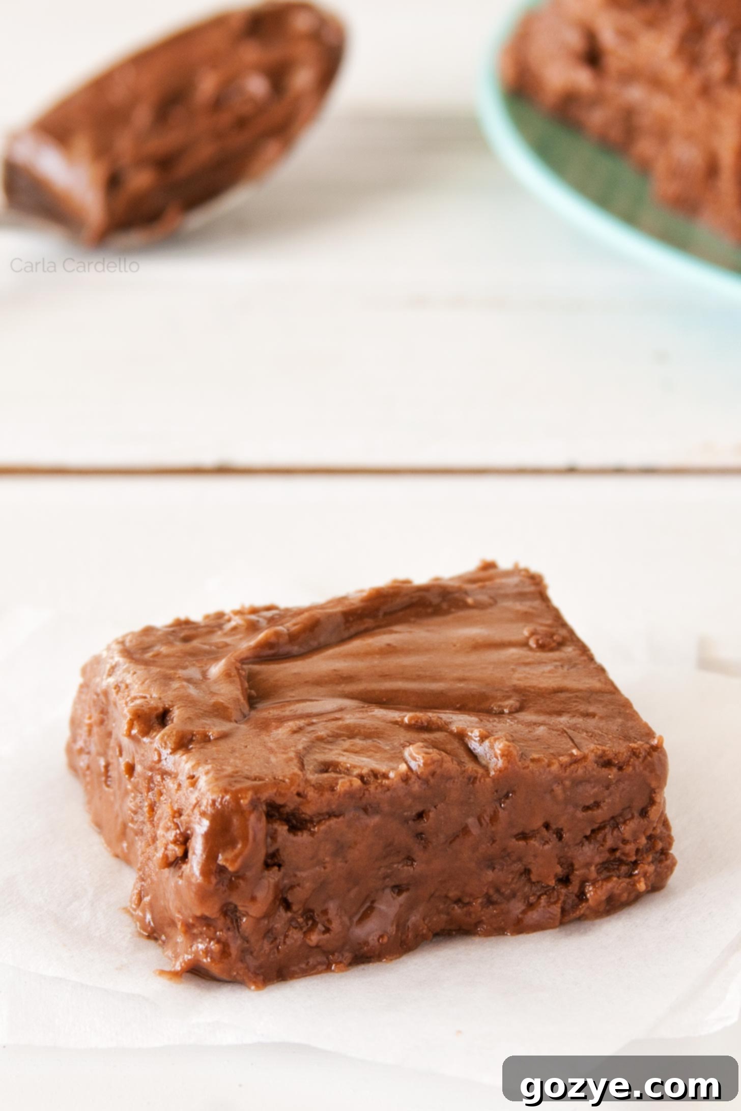 Decadent Nutella Fudge 2 Close up of one Nutella Fudge square, showing its smooth texture and rich, glossy brown color.