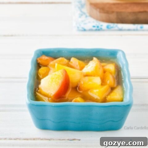 Peach pie filling in a rustic blue bowl, ready for a recipe