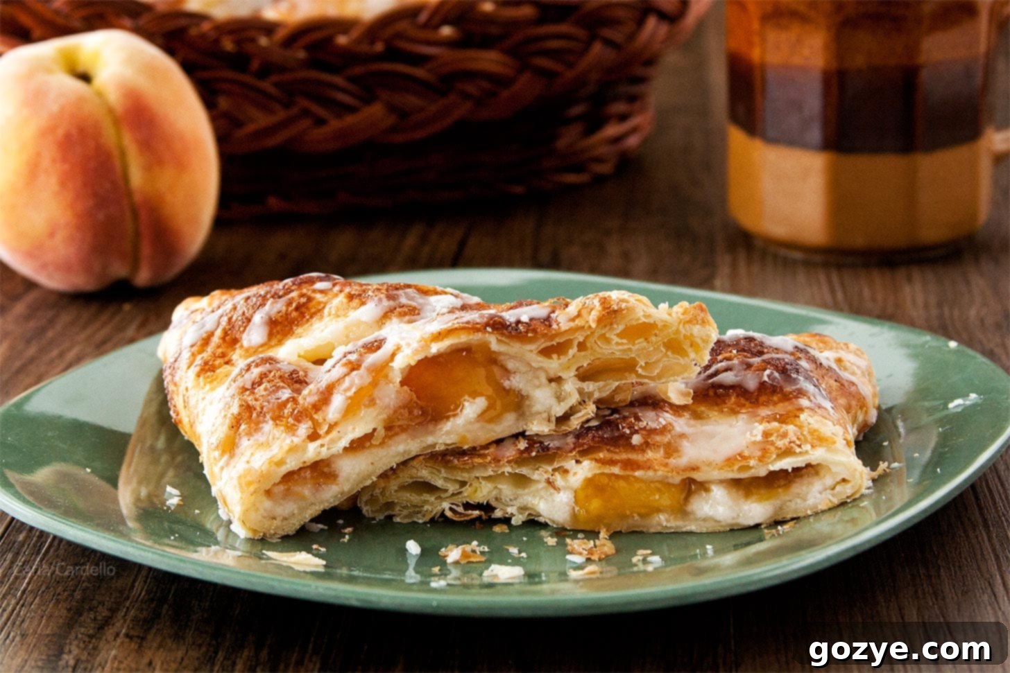 Close up of several peach turnovers arranged on a plate