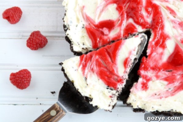 Slice of Raspberry Swirl Cheesecake Tart on a plate, ready to be enjoyed as a refreshing summer dessert.