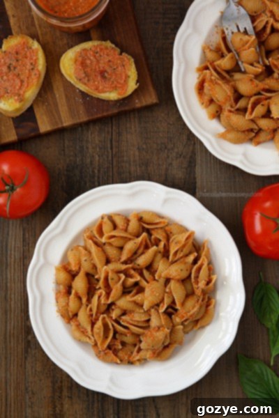 Close-up of vibrant Caprese Tomato Pesto with pasta