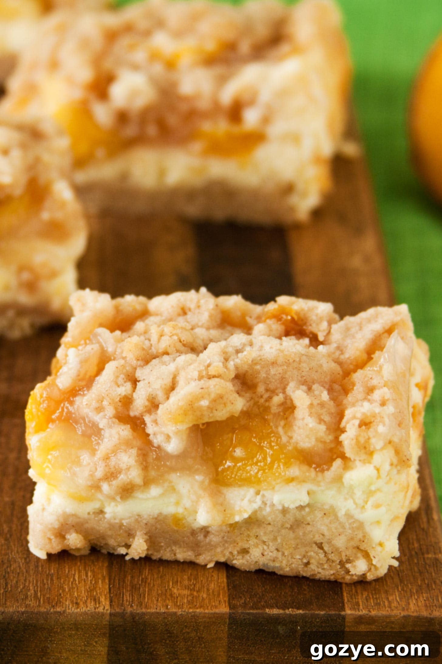 Peach Crumb Bars with cheesecake layer