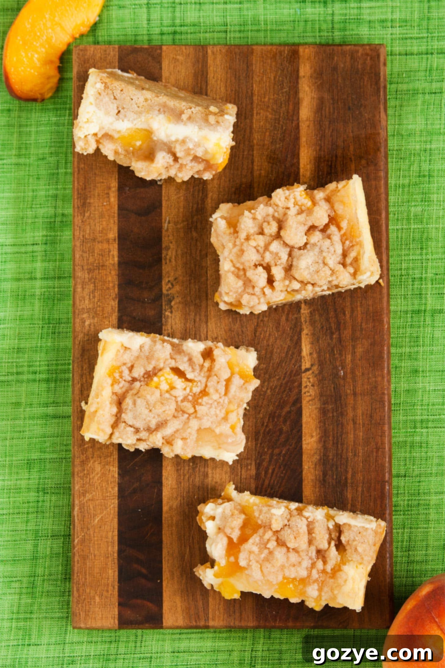Peach Crumb Bars on wooden cutting board