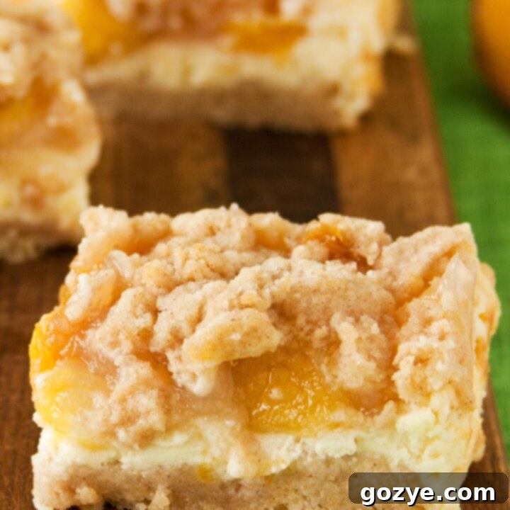 Juicy Peach Crumble Squares 6 Peach Crumb Bars with cheesecake layer