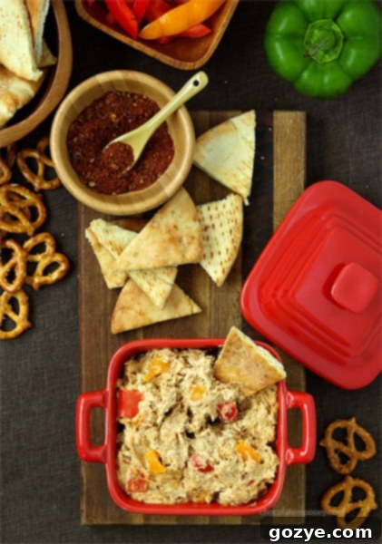 Close-up of Chicken Fajita Dip garnished with fresh cilantro and bell pepper strips