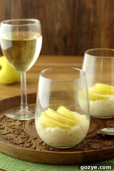 Creamy Homemade Tapioca Pudding topped with vibrant fresh apple slices, a delightful dessert.