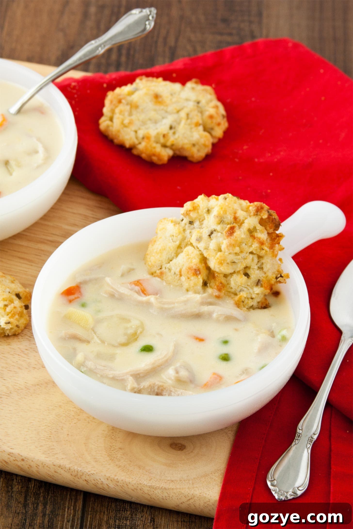 Delicious Chicken Pot Pie Soup with homemade cheddar biscuits, ready to serve from scratch