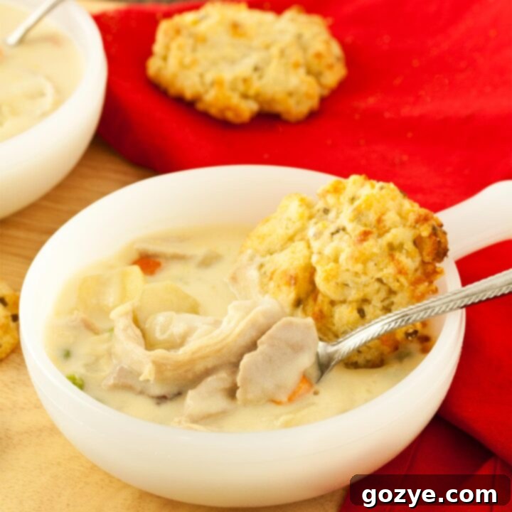 Chicken pot pie soup with spoon