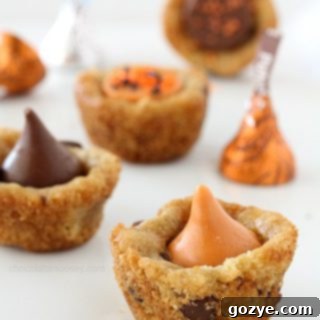 Pumpkin Spice Kissed Cookie Cups 5 Beautifully decorated Pumpkin Spice Kiss Cookie Cups with fall sprinkles